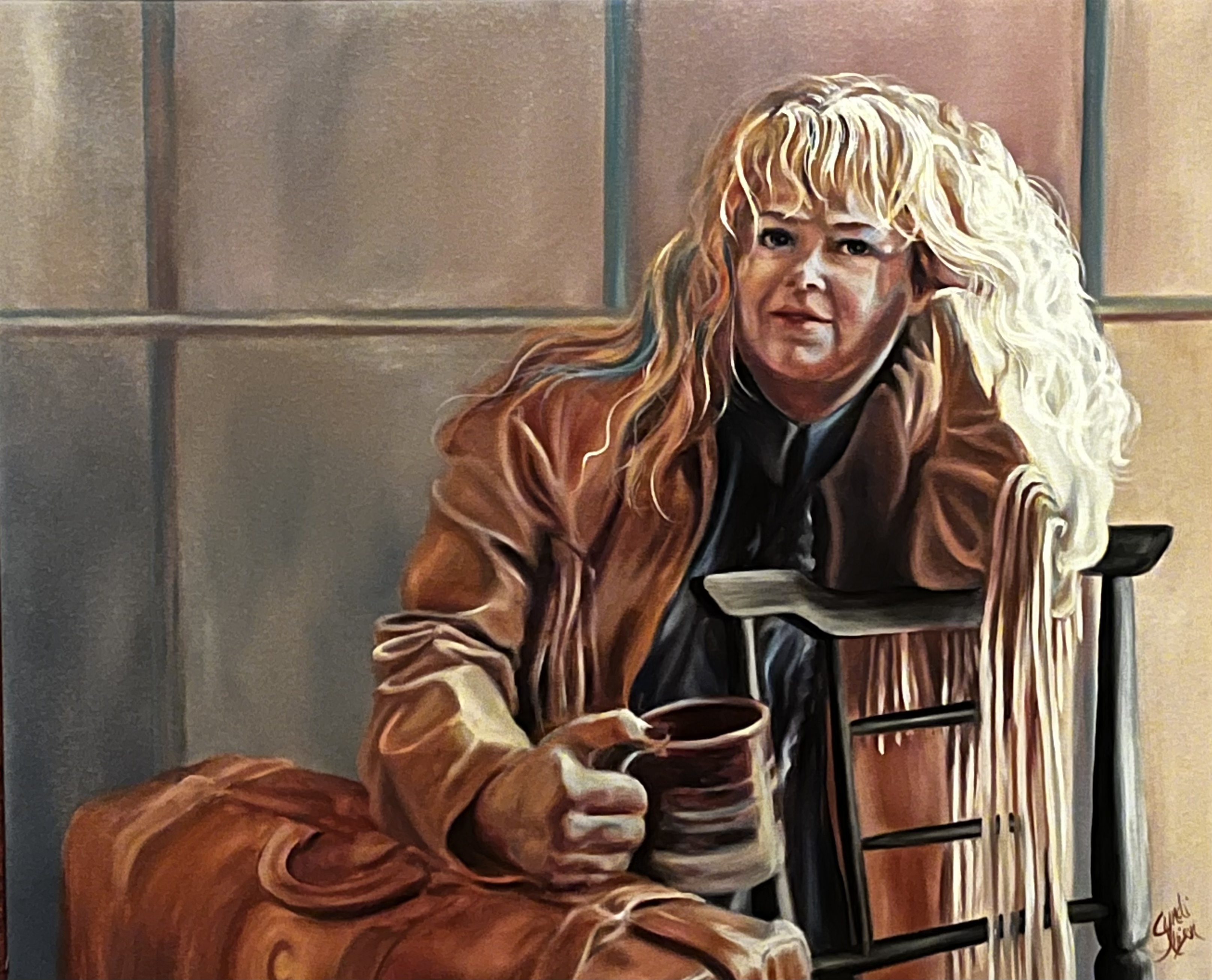 Woman in brown jacket with coffee