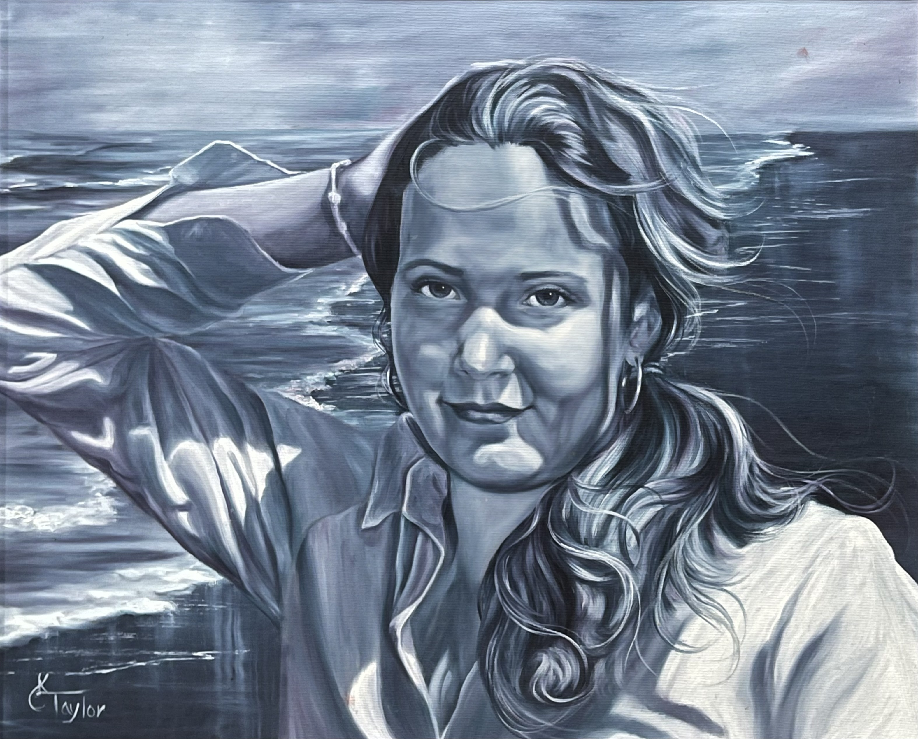 Black and white portrait of woman with wind in her hair