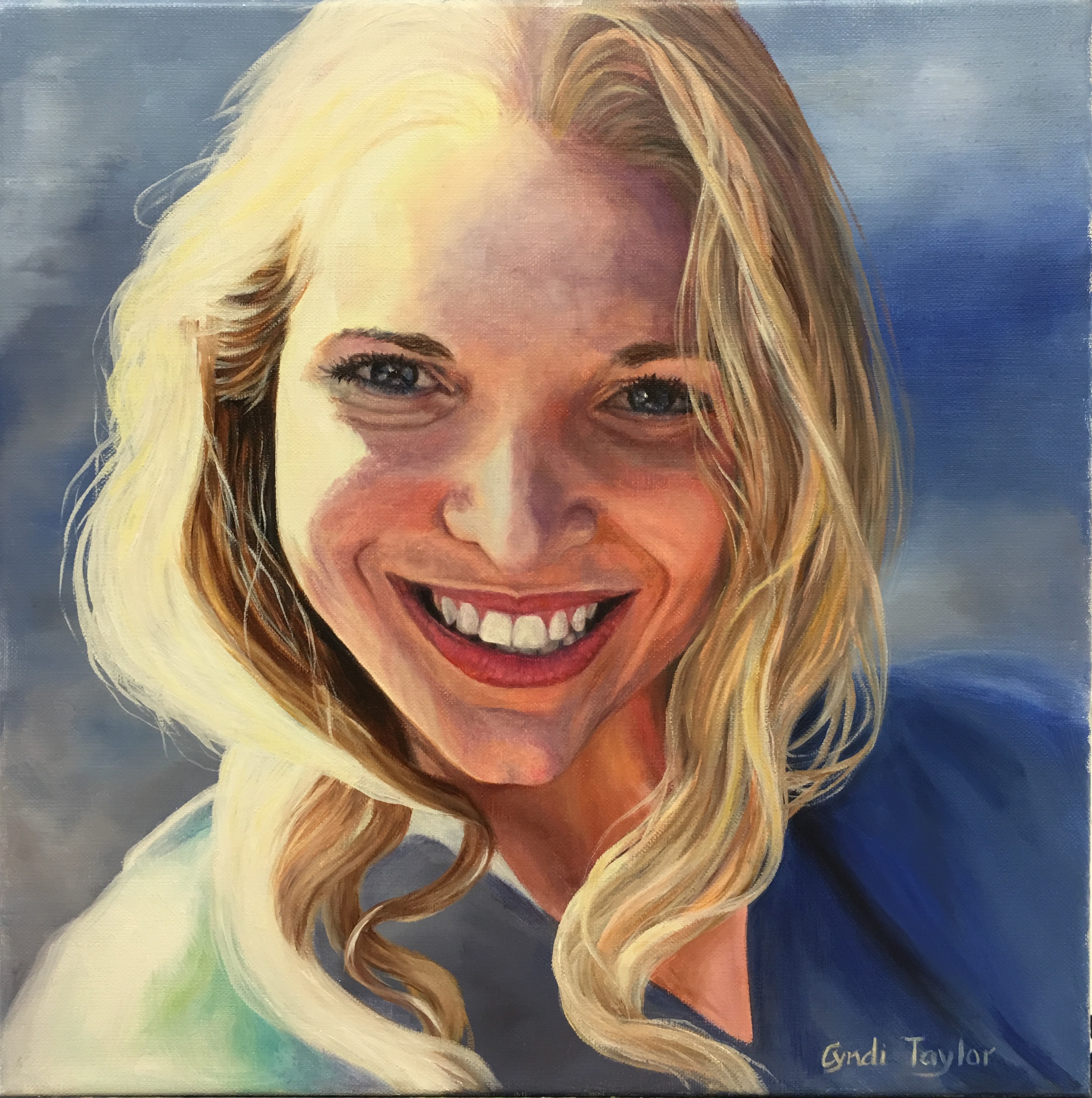 Smiling blonde woman with ocean in background